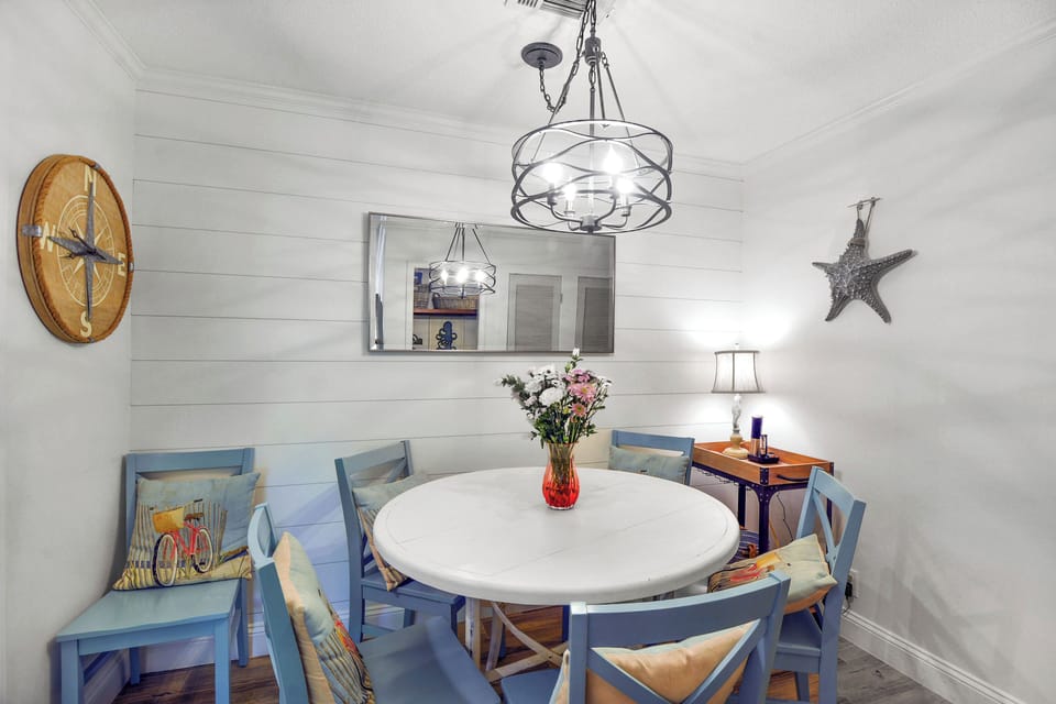 Alternate Dining Space – Ocean Walk J-11 - Another look at the dining nook shows off coastal flair, sweet lighting touches, and the kind of space that makes everyday meals feel special.