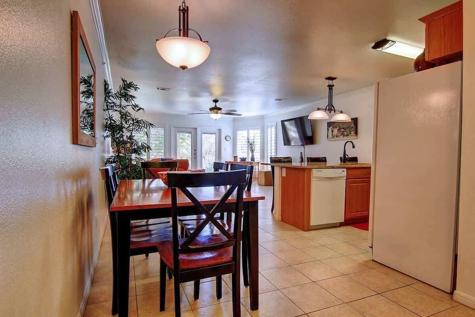Dining table located near the kitchen! 