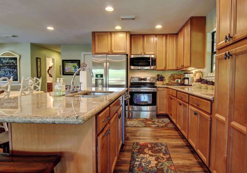 Kitchen (upstairs) stocked with pots/pans/utensils.