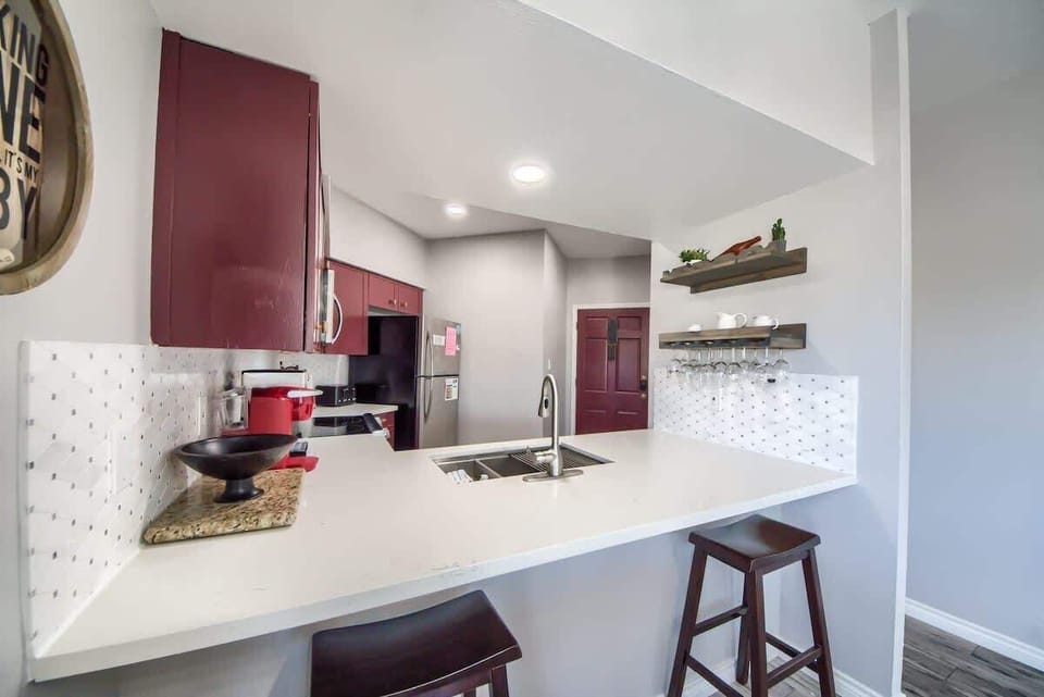 Kitchen with seating for two at the coffee bar.