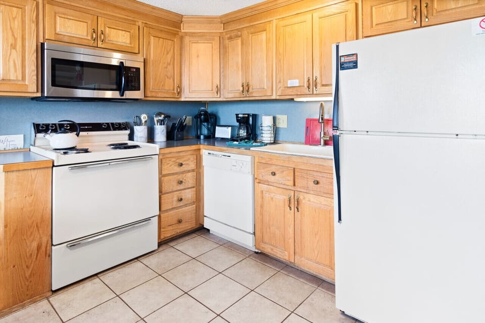 Fully-equipped kitchen includes pots, pans and utensils