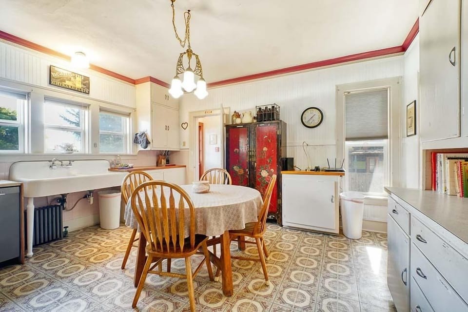 Enjoy your morning coffee with family in our cozy kitchen, featuring seating for four at the breakfast table.