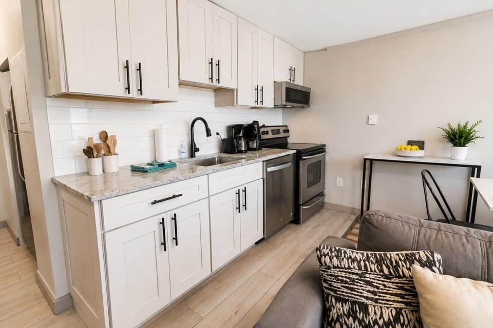 Remodeled kitchen is fully-equipped with pots, pans & utensils