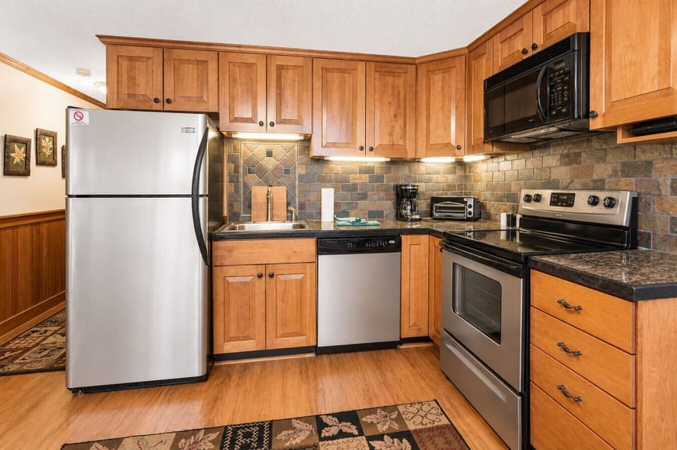 Remodeled kitchen is fully-equipped with pots, pans & utensils.