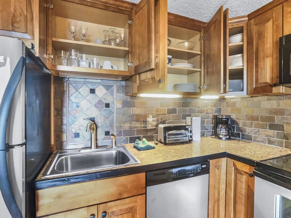 Remodeled kitchen is fully-equipped with pots, pans & utensils.