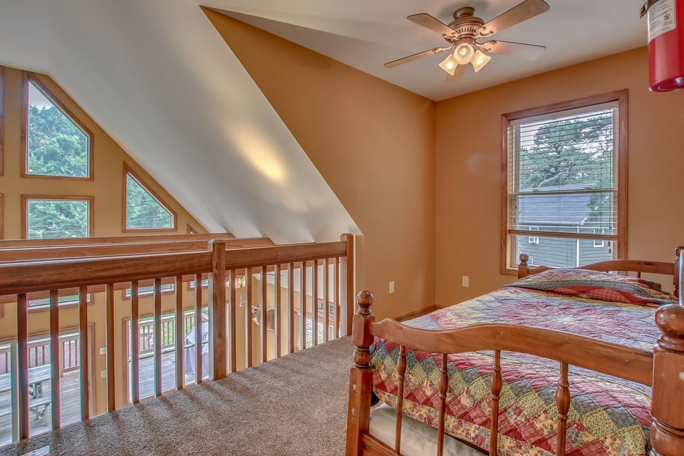 tan bedroom with sleeper sofa on second floor
