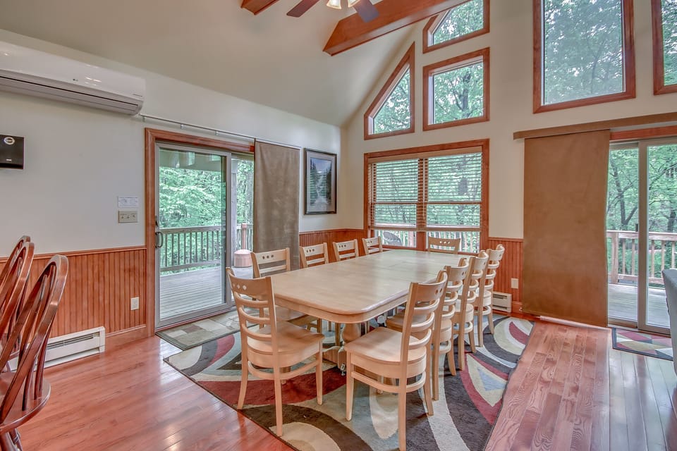 Dining Table and Chairs, with Sliding Glass Door to the Outdoor Patio.