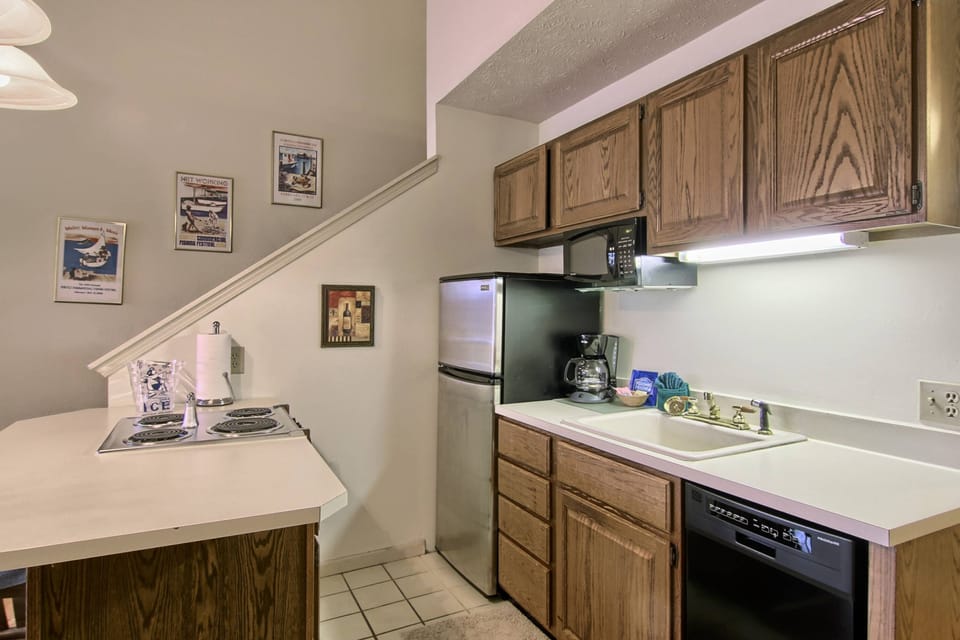 Kitchen - This kitchen has a full-sized fridge, stove, microwave, dishwasher, toaster and coffee maker