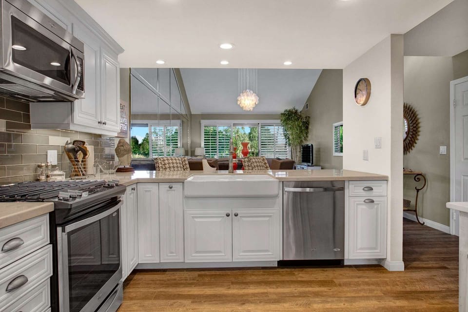 Gorgeous updated kitchen opens up to the dining and living area
