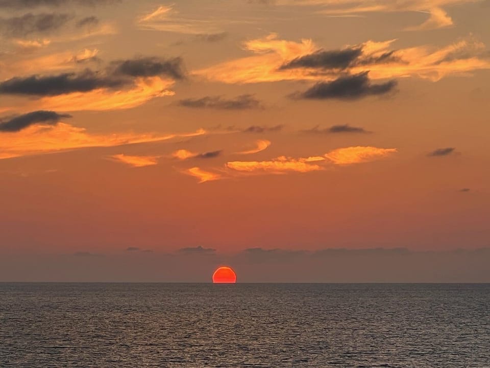 Sunset from the balcony sent to us from a guest