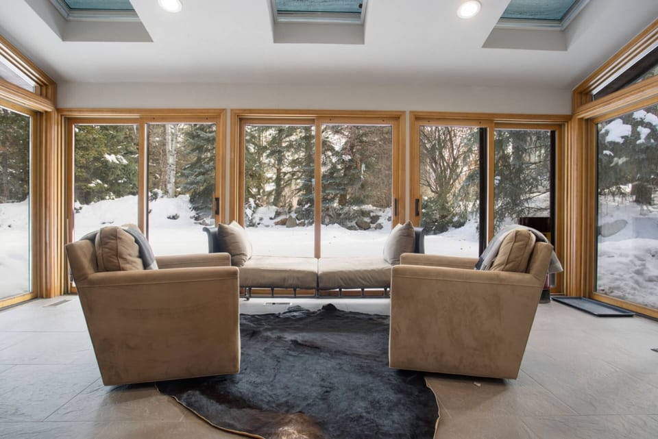 Embrace the beauty of the winter in the sunroom.