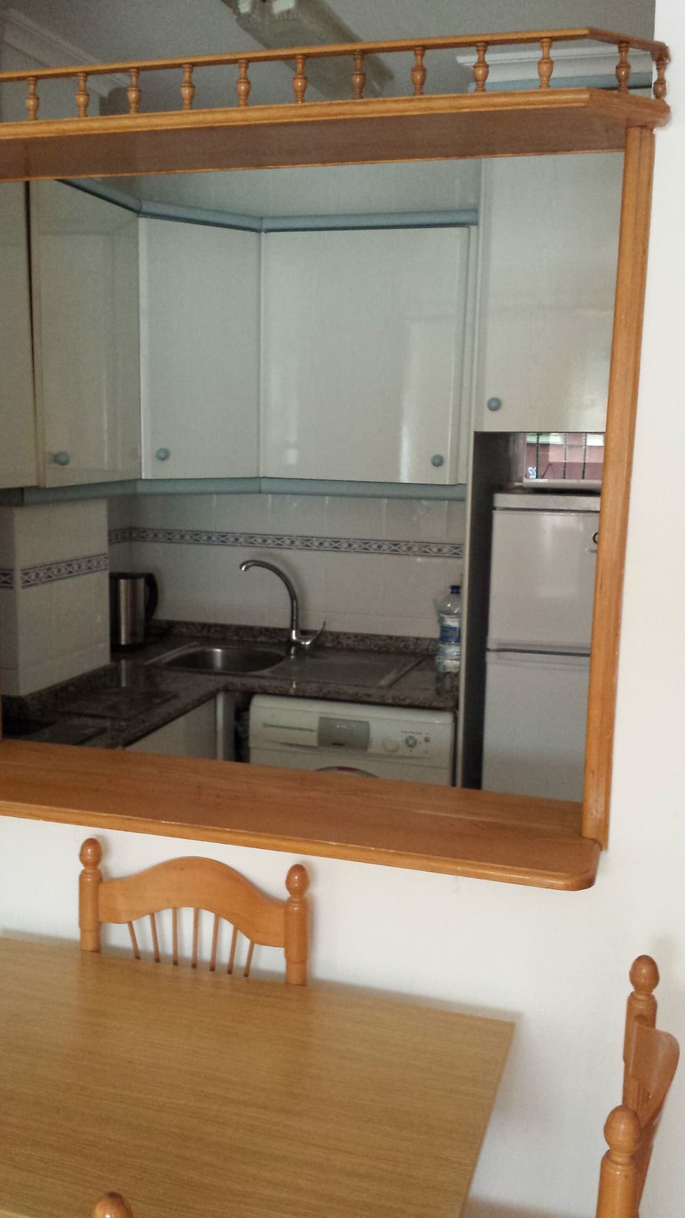 A view of the kitchen from the dining area.