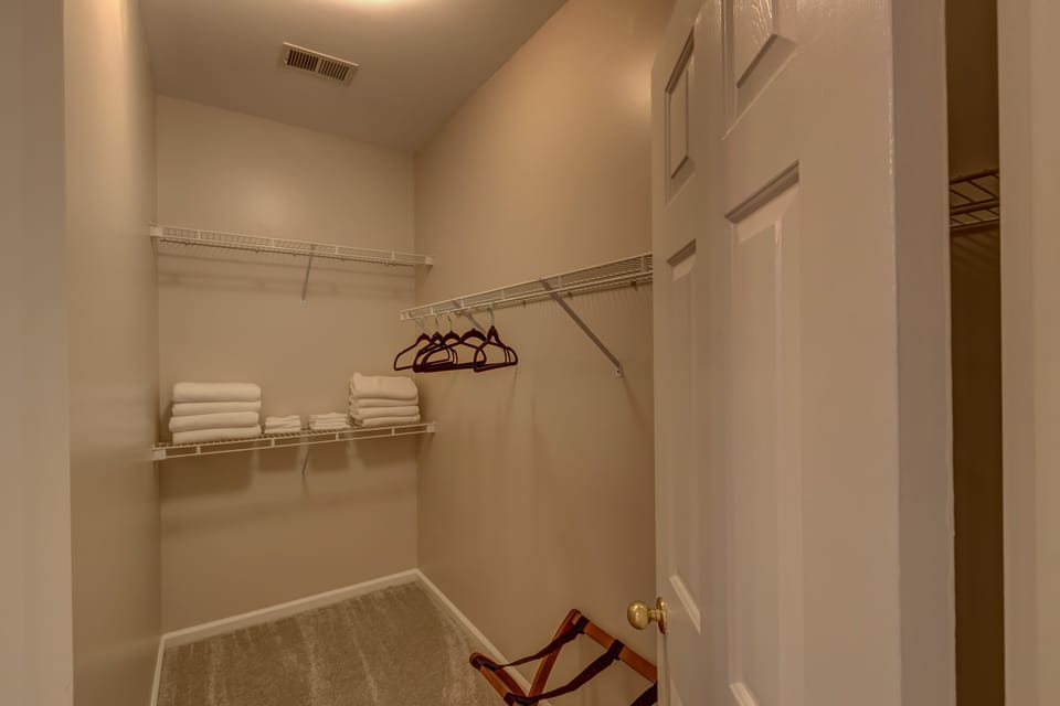 There is ample room in the Master Bedroom Closet. Plenty of hangers & towels too