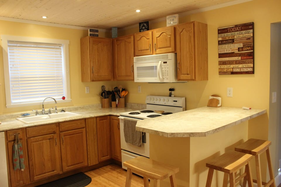 Beautiful kitchen which includes stove, microwave, dishwasher, etc.