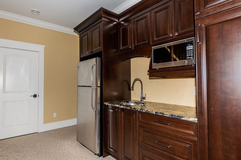 Family room kitchenette, full sized fridge, microwave, sink