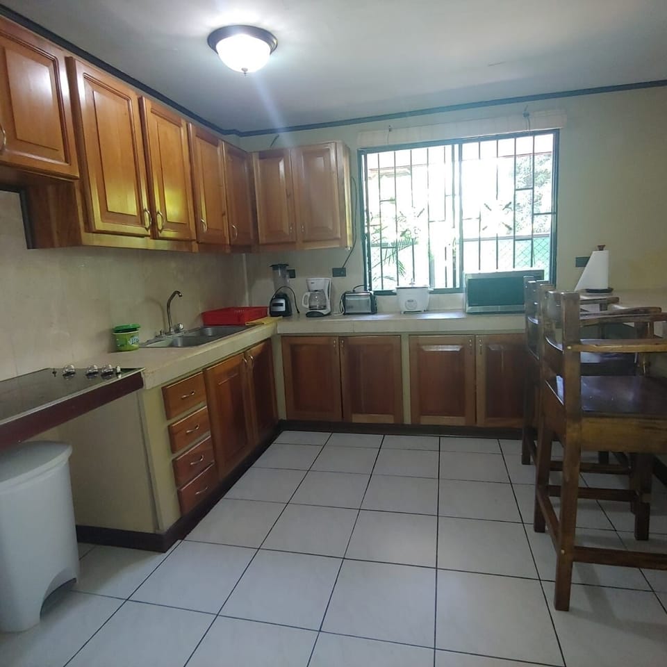 Modern spacious kitchen with all the utensils needed.