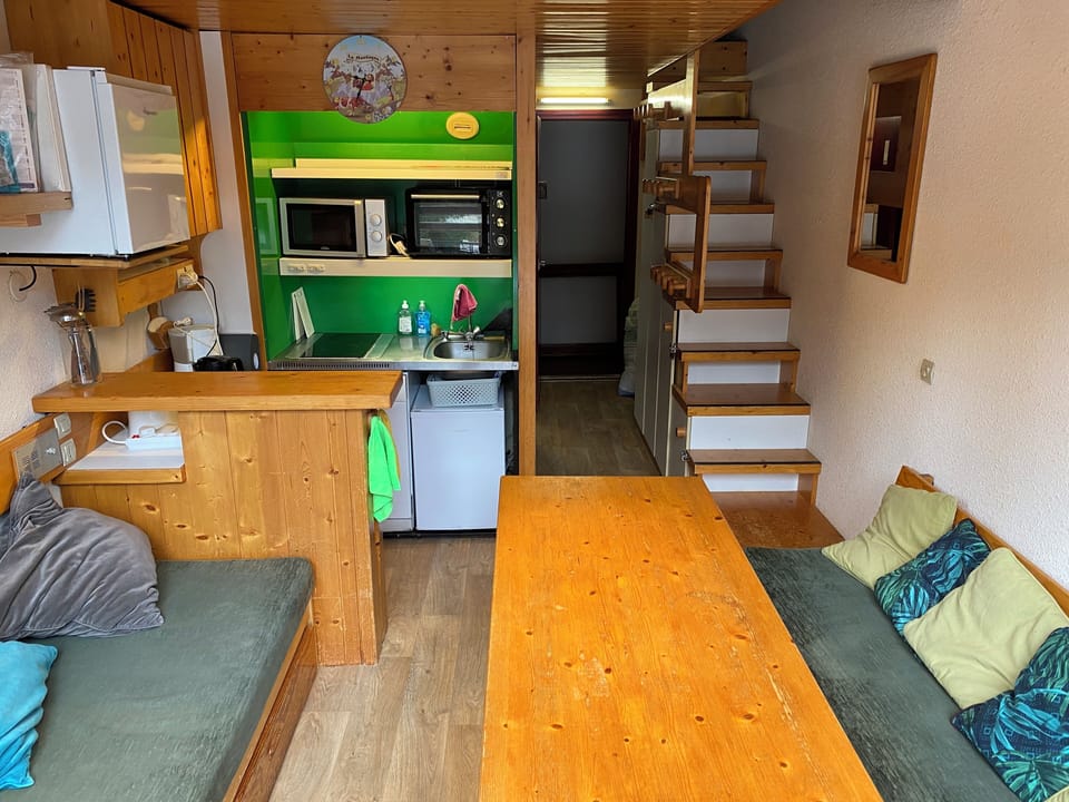 View of the kitchen and stairs leading to the upstairs bedrooms.
