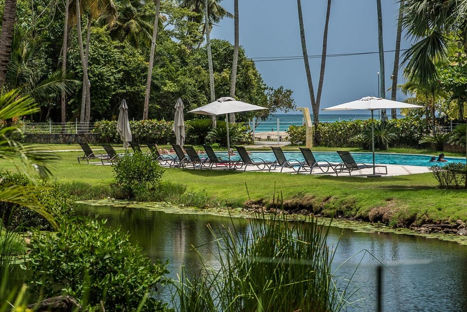 Property communal pool with beach view