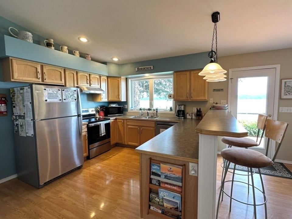 Spacious and well-equipped kitchen with all your creature comforts of home. 