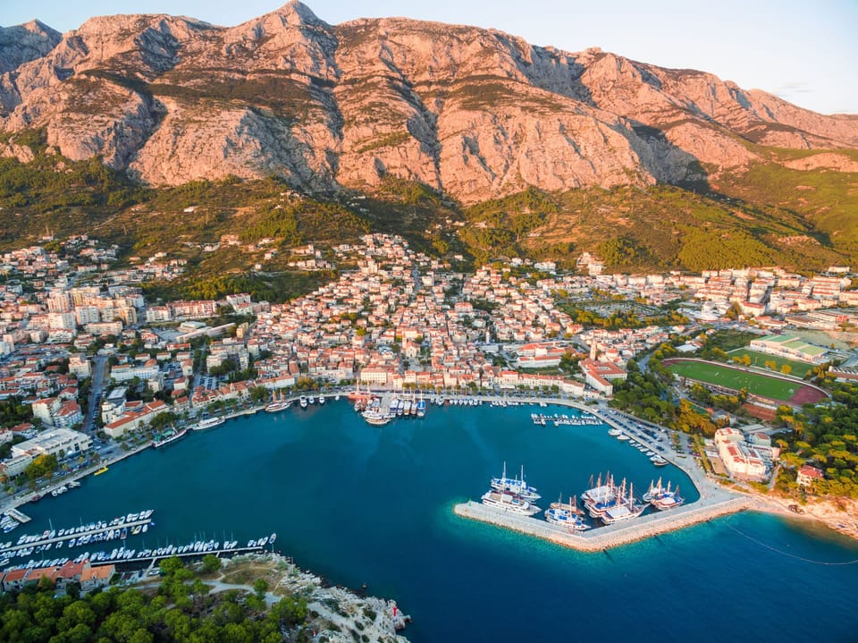Makarska with Biokovo mountain range and smell of the Mediterranean, pine trees.