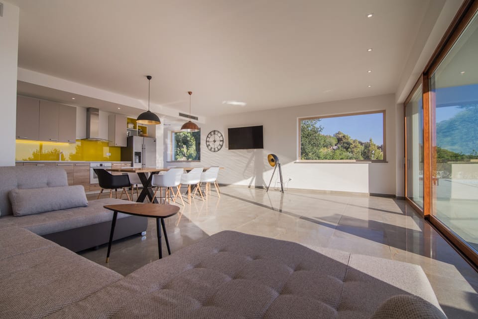 Big open space with wide glass walls connects you with nature.
