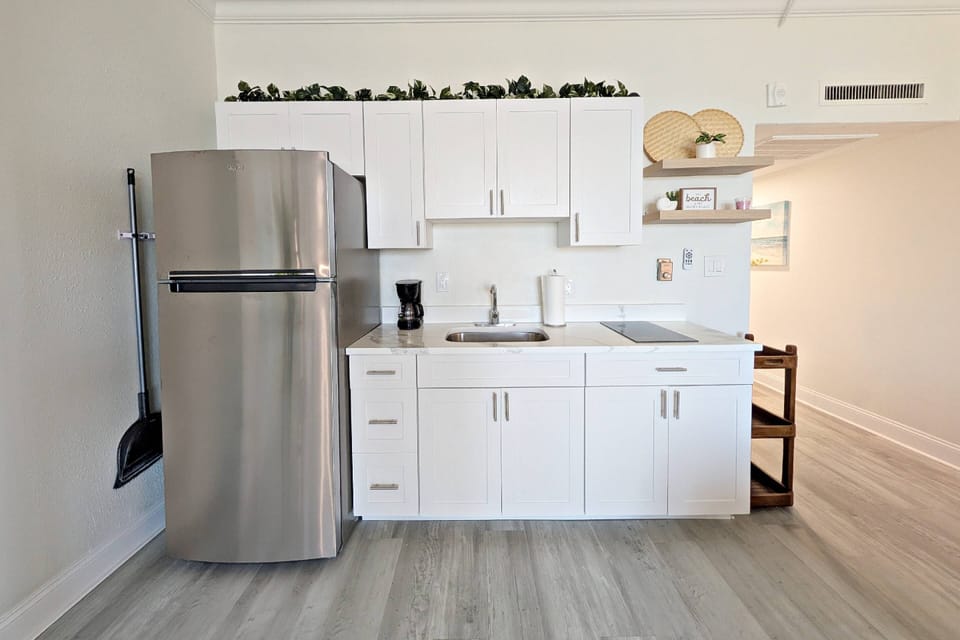 Kitchenette with full size refrigerator, 2 burner stove, microwave,...