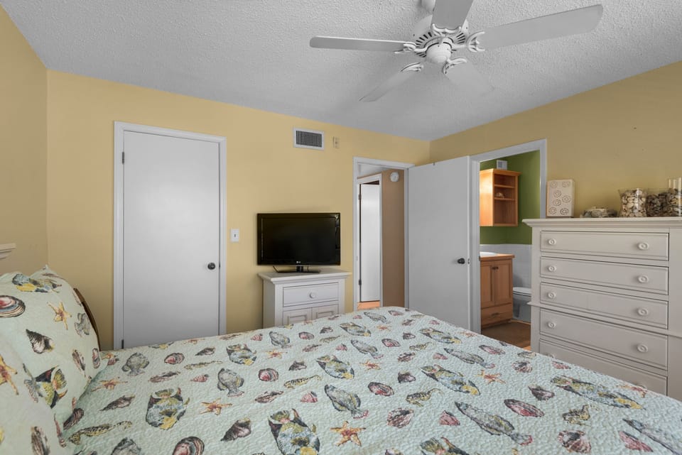 Master bedroom with flatscreen TV and en suite