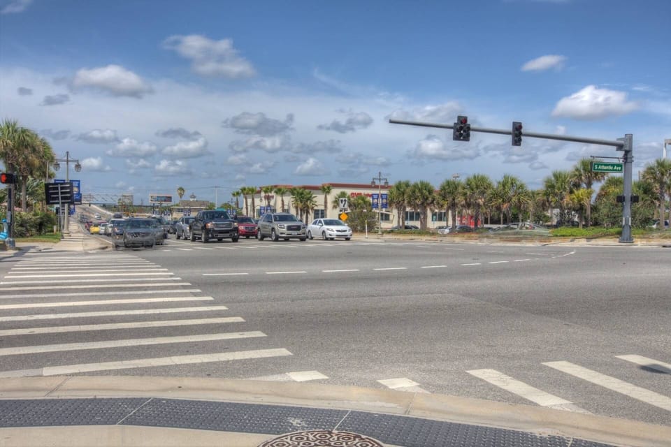 Dunlawton Bridge at a distance with restaurants underneath it all within walking distance.