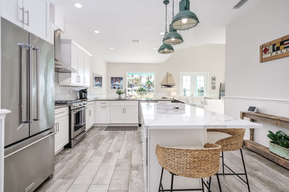 The seating around the kitchen island is the perfect place to eat breakfast before hitting the beach!