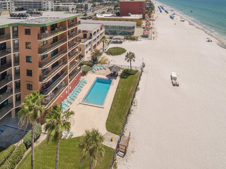 Beachfront property with pool and direct beach access on pristine sandy shores.