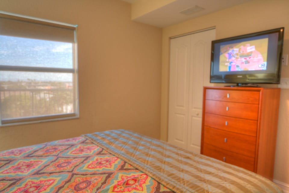Second Bedroom with a Queen Size Bed and Flatscreen TV