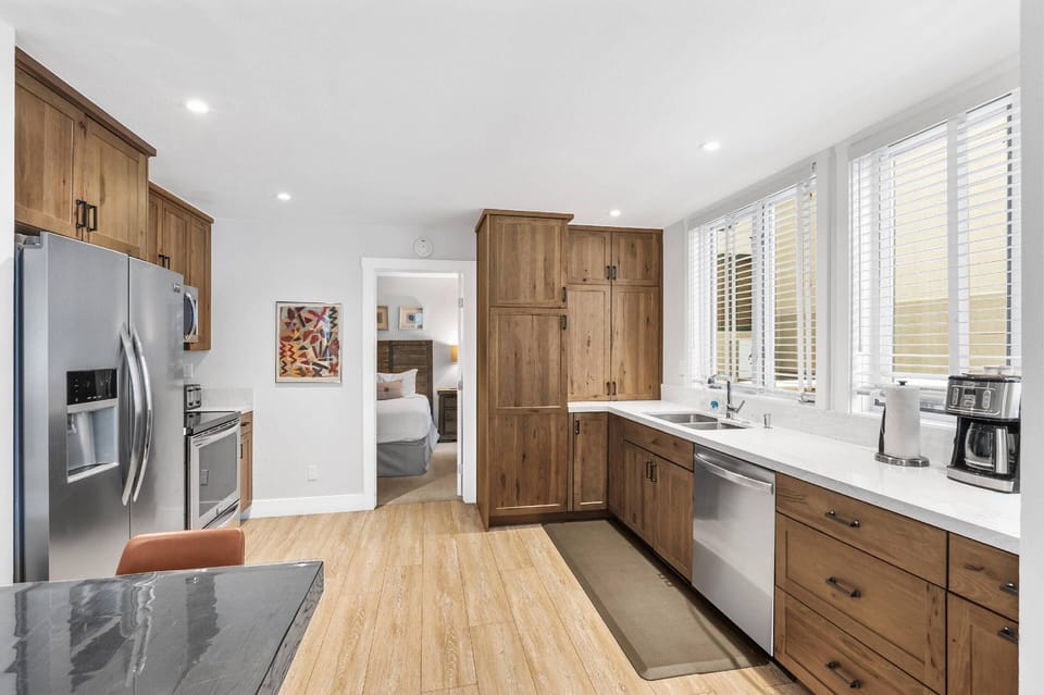 The spacious kitchen area is fully stocked for you to prepare great meals during your stay.