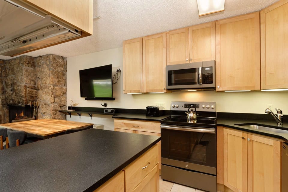 There is plenty of counter space in this small, well equipped kitchen.  A perfect place for a quick lunch during your ski day.