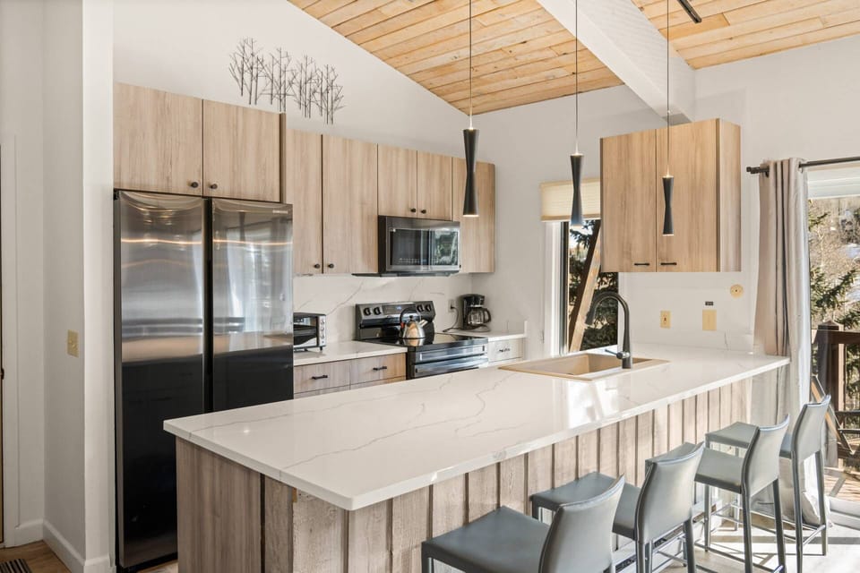 This newly updated kitchen features stainless appliances and beautiful new countertops.