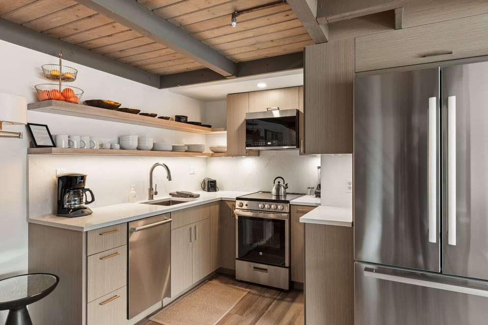 The lovely modern kitchen has everything you need to enjoy meals at home during your stay in Snowmass!
