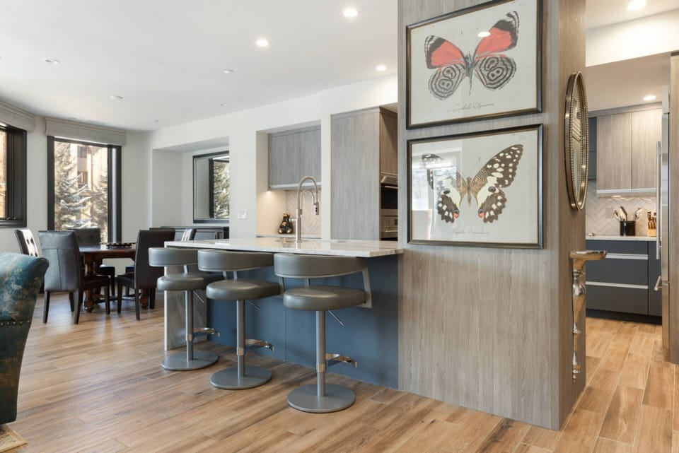 Open-concept kitchen seamlessly flows into a dining area for six, perfect for entertaining and family gatherings.