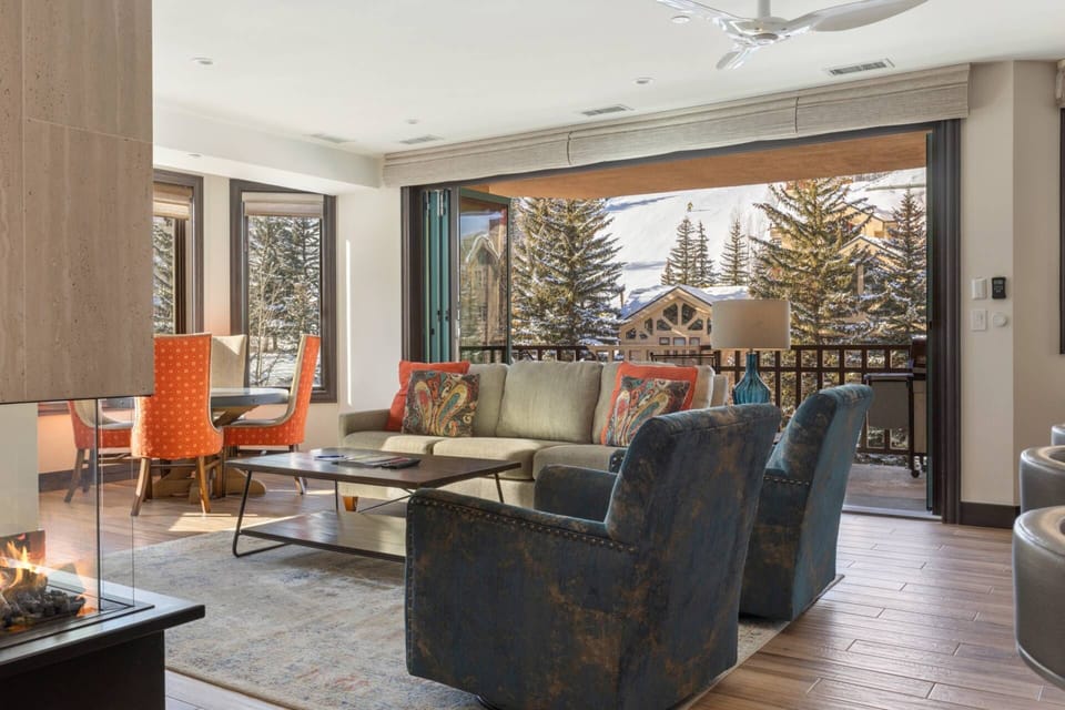 Enjoy stunning ski run views from the living room, featuring a brand new accordion patio door for effortless outdoor access!