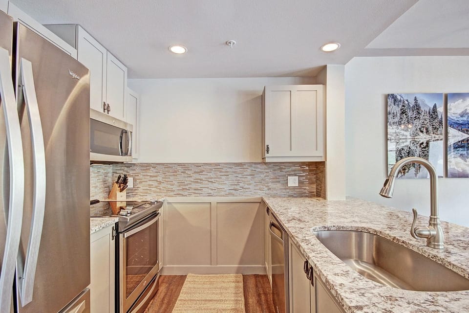Beautifully updated kitchen with stainless steel appliances.