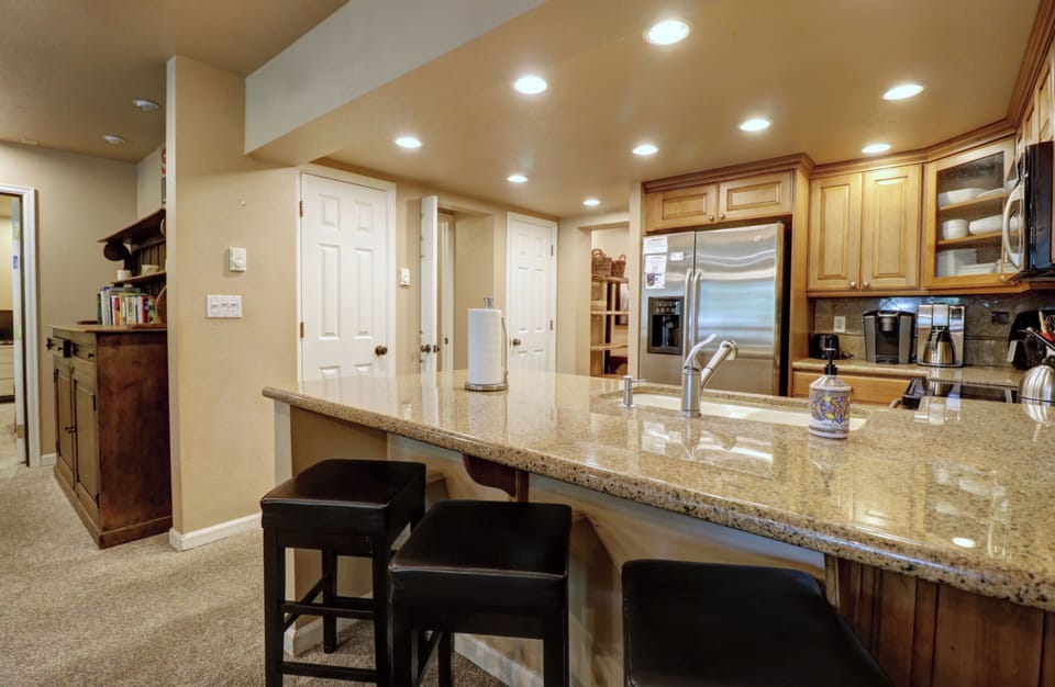 Bar stool seating in kitchen.