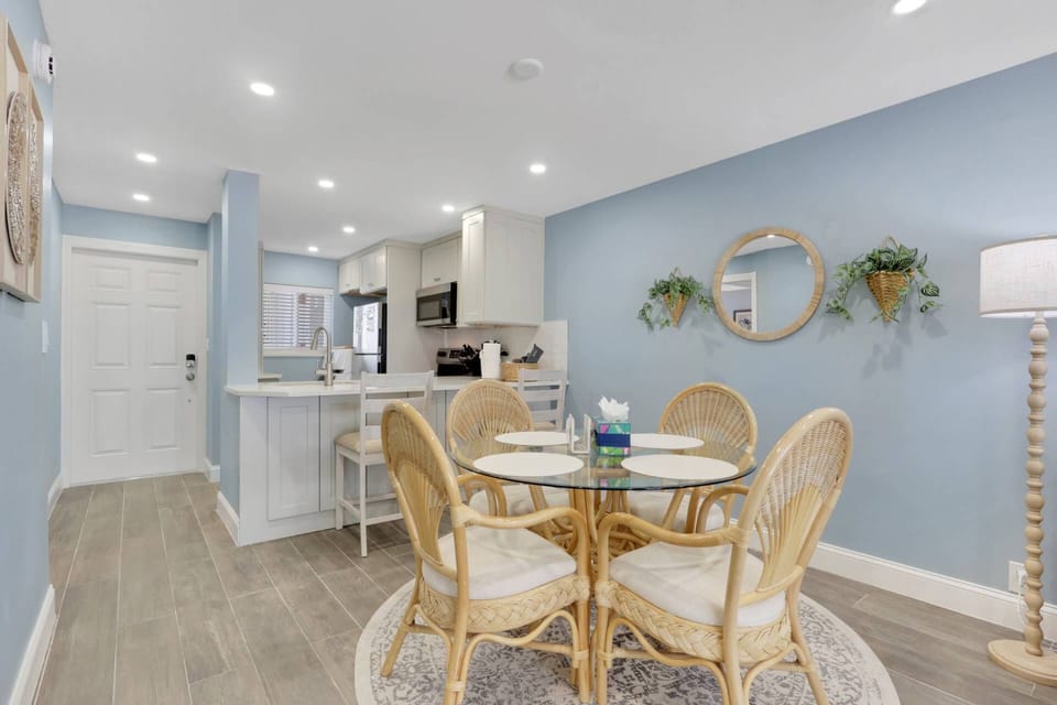Four can dine, or enjoy a friendly game of cards, at the table between the living area and kitchen.