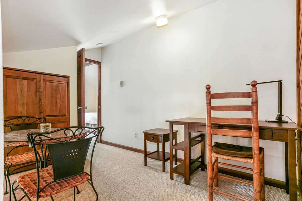 Small gathering area located at the top of the stairs, outside the master suite.
