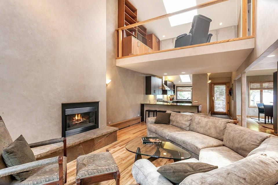 View of living, kitchen, entry, dining and master den loft.