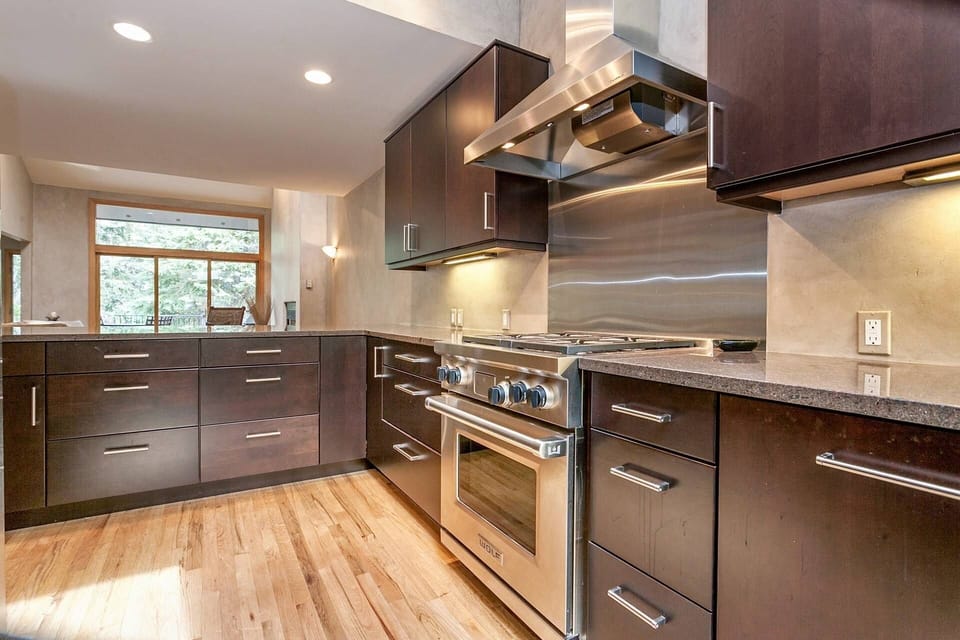 Spacious kitchen with bar seating.