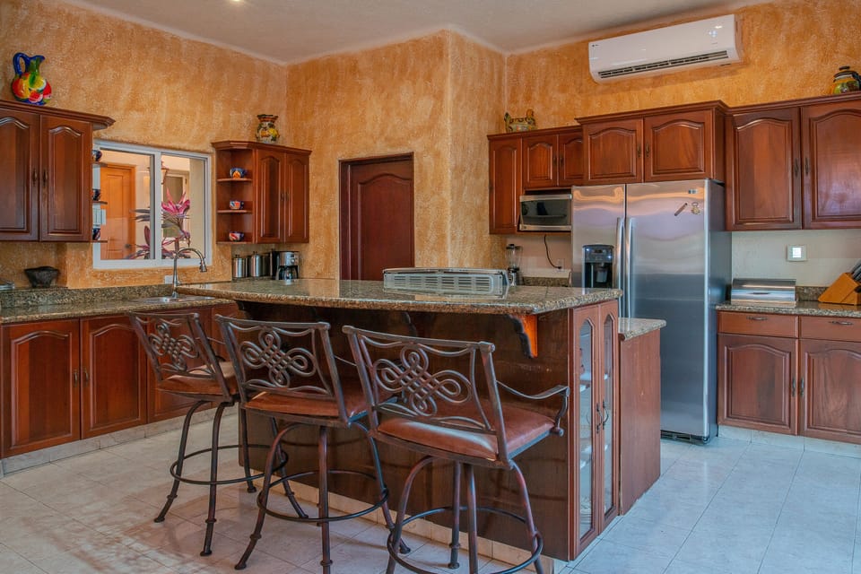 Fully equipped kitchen with seating bar