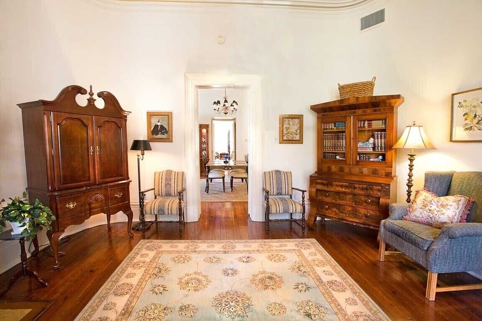 There is a flat screen television located in the antique armoire.