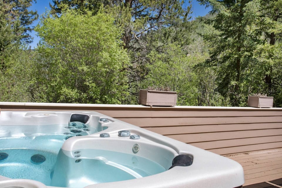 Private hot tub right off the main living room with views of nature.