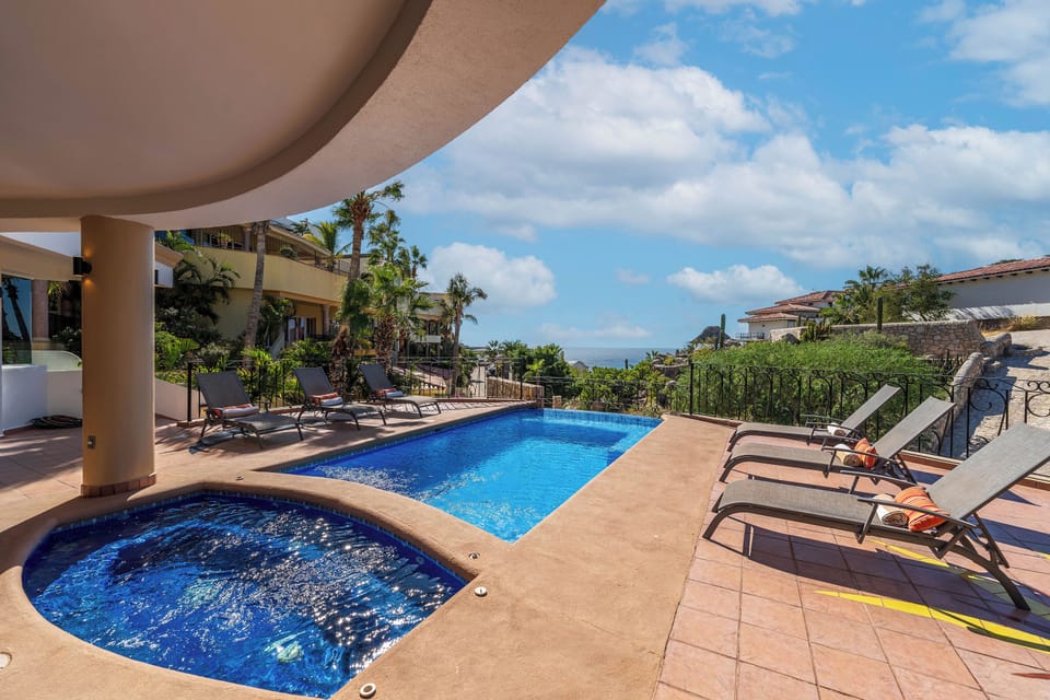 Sunny patio with jacuzzi and ocean view