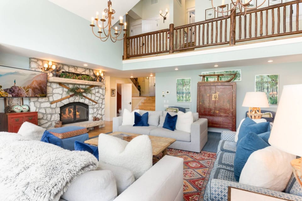 The stunning living room opens right up into the lofted floor above!