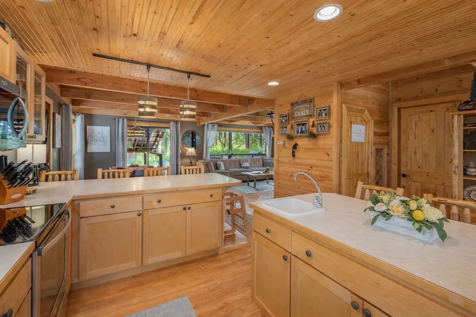 Your rustic cabin kitchen welcomes you with warm wood finishes and modern amenities for memorable meal preparation.