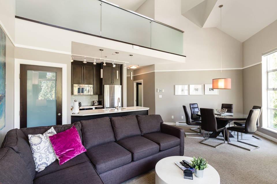 Showing the open plan, upper loft and vaulted ceilings